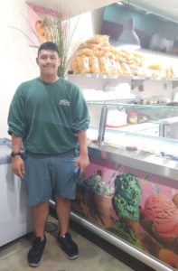 Senior Jorge Guzman in his parents ice cream shop.