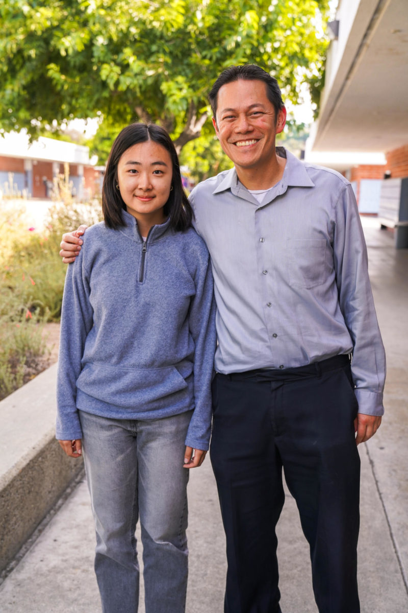 Senior Christina Wang stands with Chemistry teacher Garrett Lim.