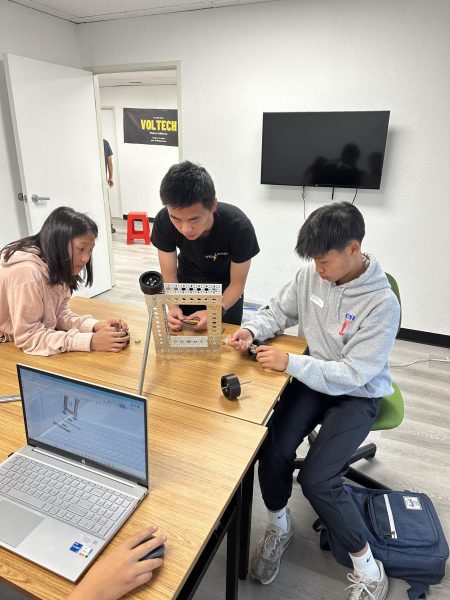 Junior Anson Lin teaches students how to build and program computer software and robots. 