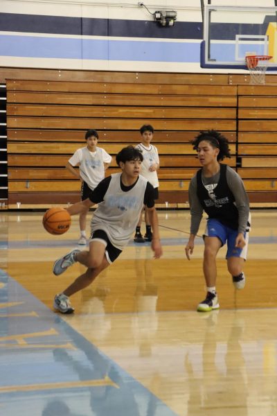 Point guard sophomore Jacob Ventura moves along the baseline, challenging small forward junior Myles
Wainwright to create an open look for his teammate. This years practice is more serious and competitive. Given that our team is now
Division 1, were trying to elevate each others skills to perform well during matches, Ventura said.