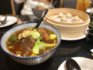 The braised beef and tendon noodle soup contains chewy noodles with a refreshing side of pickled vegetables. The two paired well together and balanced the saltiness of the beef and broth.