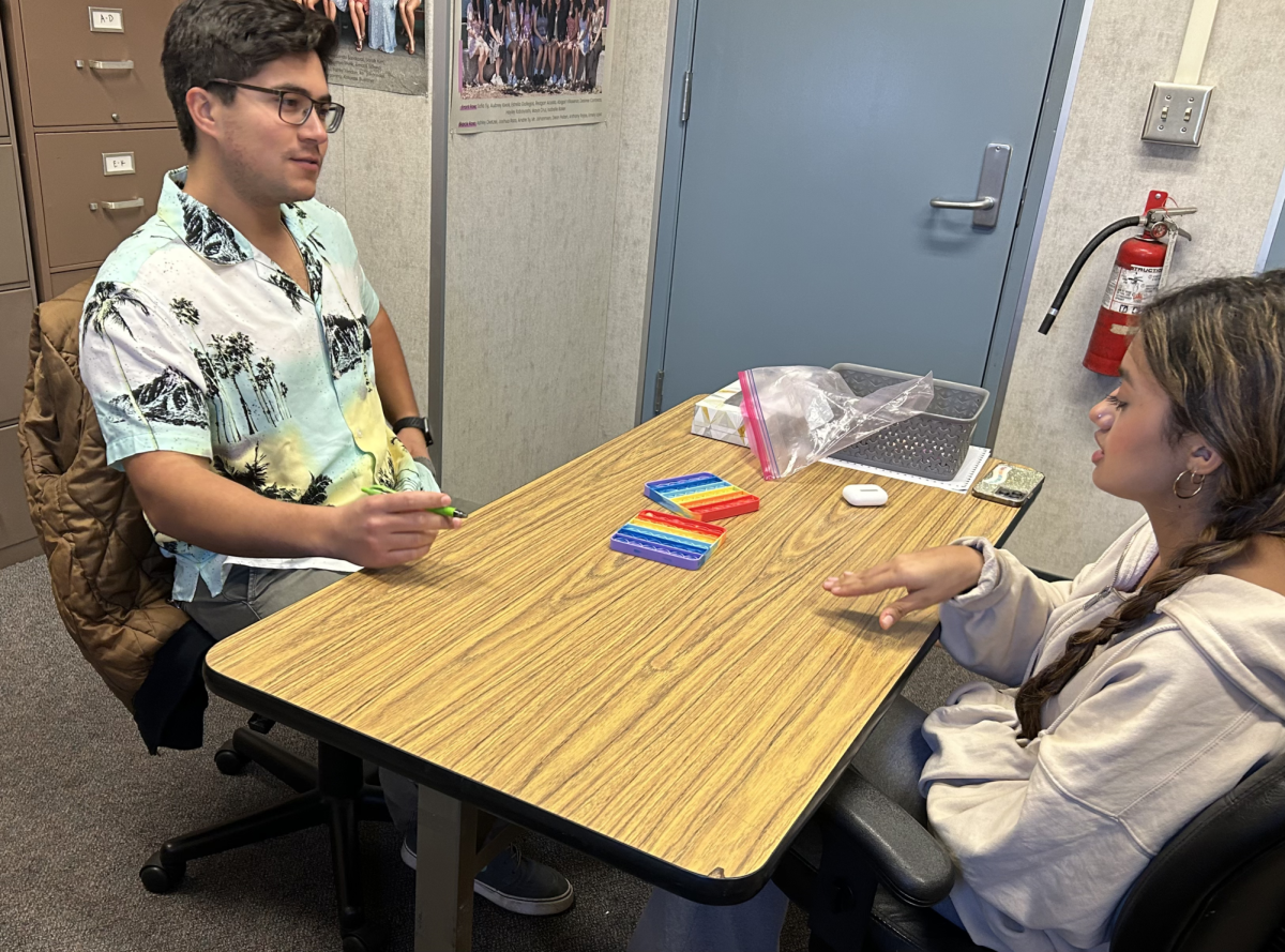 School psychologist Robby Rendon listens to junior Juliana Garcia as she seeks helps. “When handling [problems], each person is different. You should seek [professional help] when your stress or trauma significantly deters you from your life’s plan,” Rendon said. 