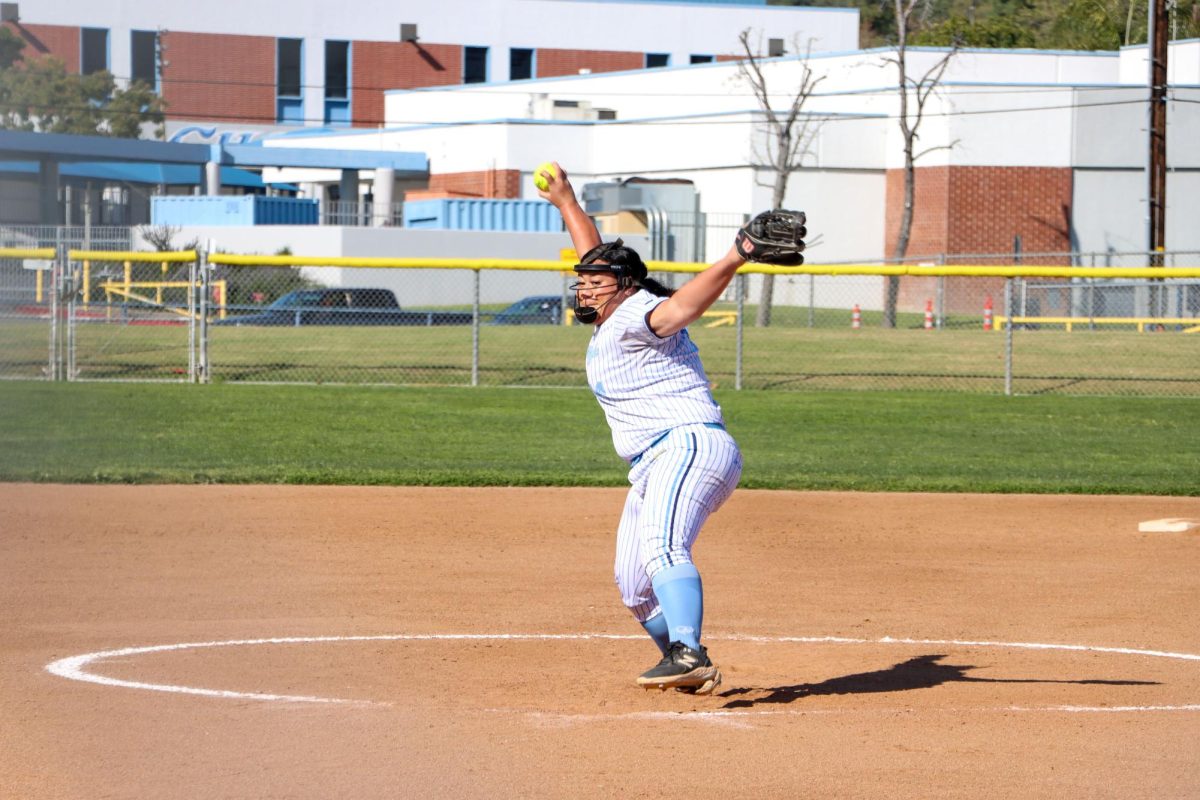 Pitcher senior Sela Halaholo secures the win with a strong throw. “The game was really high intensity, and it was kind of stressful. I feel like I pitched well and minimized the points Rowland scored,” Halaholo said. 