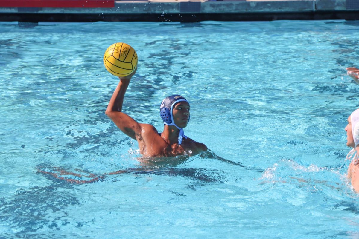 4/5 attacker junior Anthony Santos prepares to launch the ball in a Mustang win.