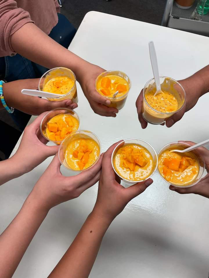 Students make mango sago in their ethnic studies class. 