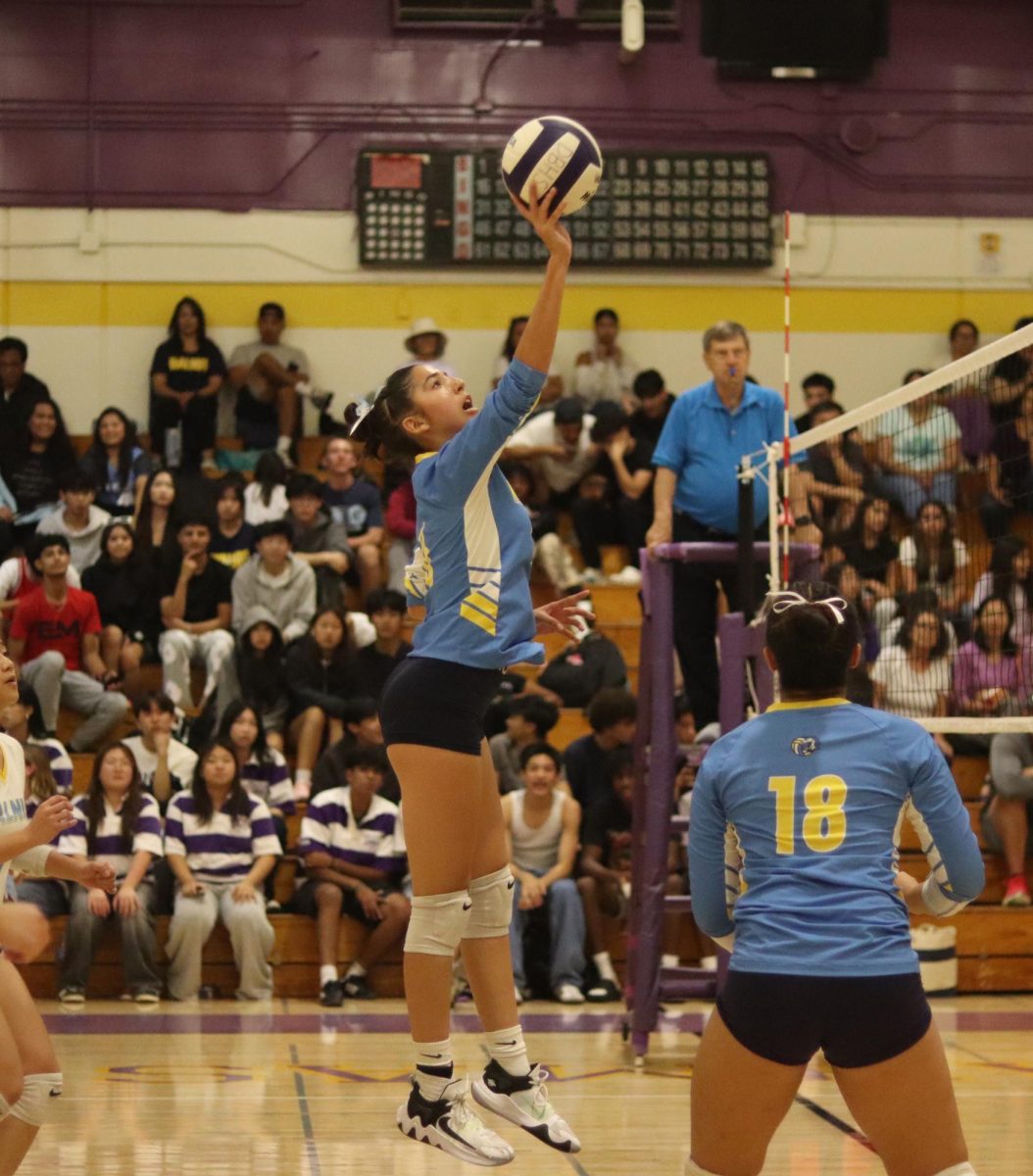 Play united | Middle hitter sophomore Sydnee Montanez tips the ball in match Tuesday, Sept. 25.  “I felt that I did a good job working with my teammates. ” 