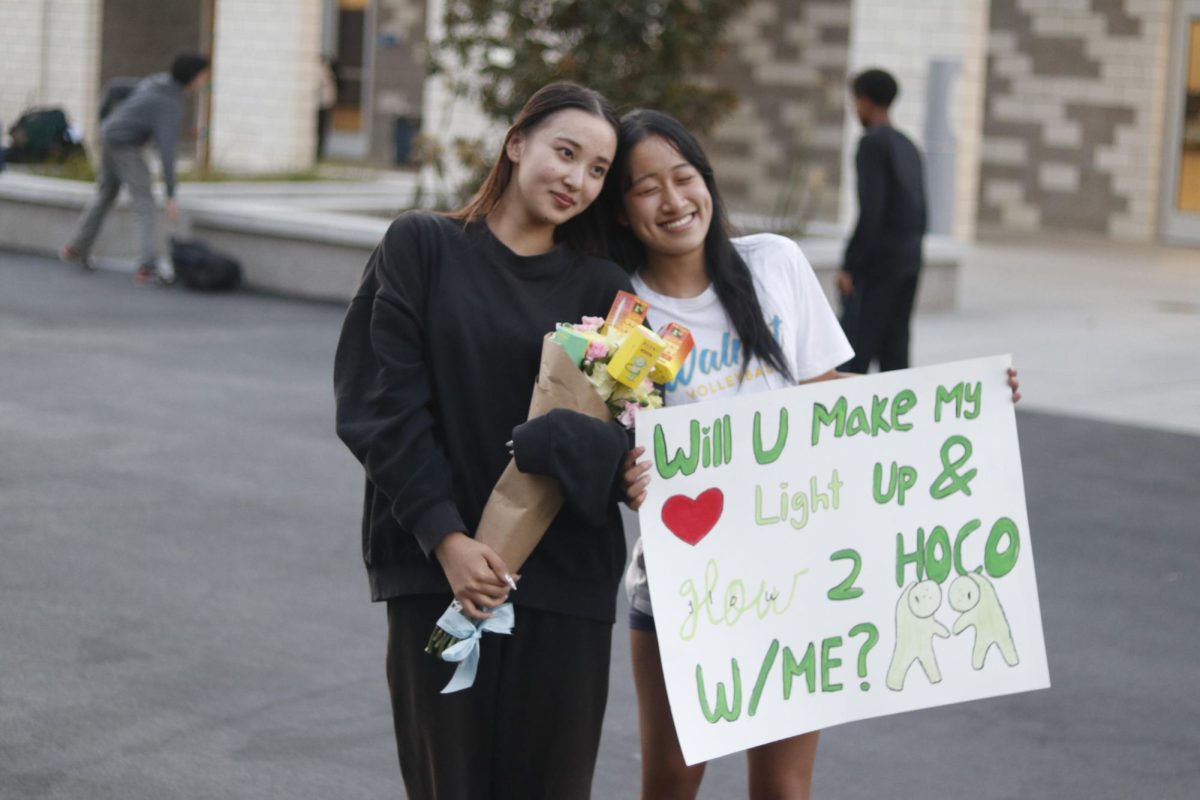 Senior Wendy Wu proposes to senior Audrey Ruangutai for Homecoming. 