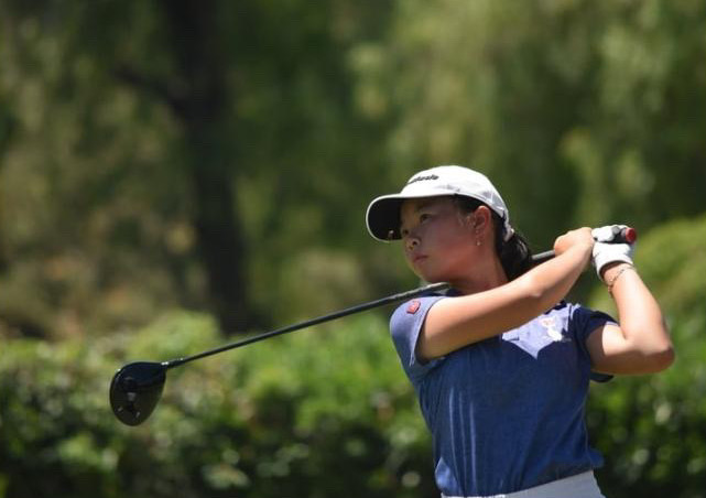 Sophomore Vivi Yen practices her swing at the Victoria Country Club.