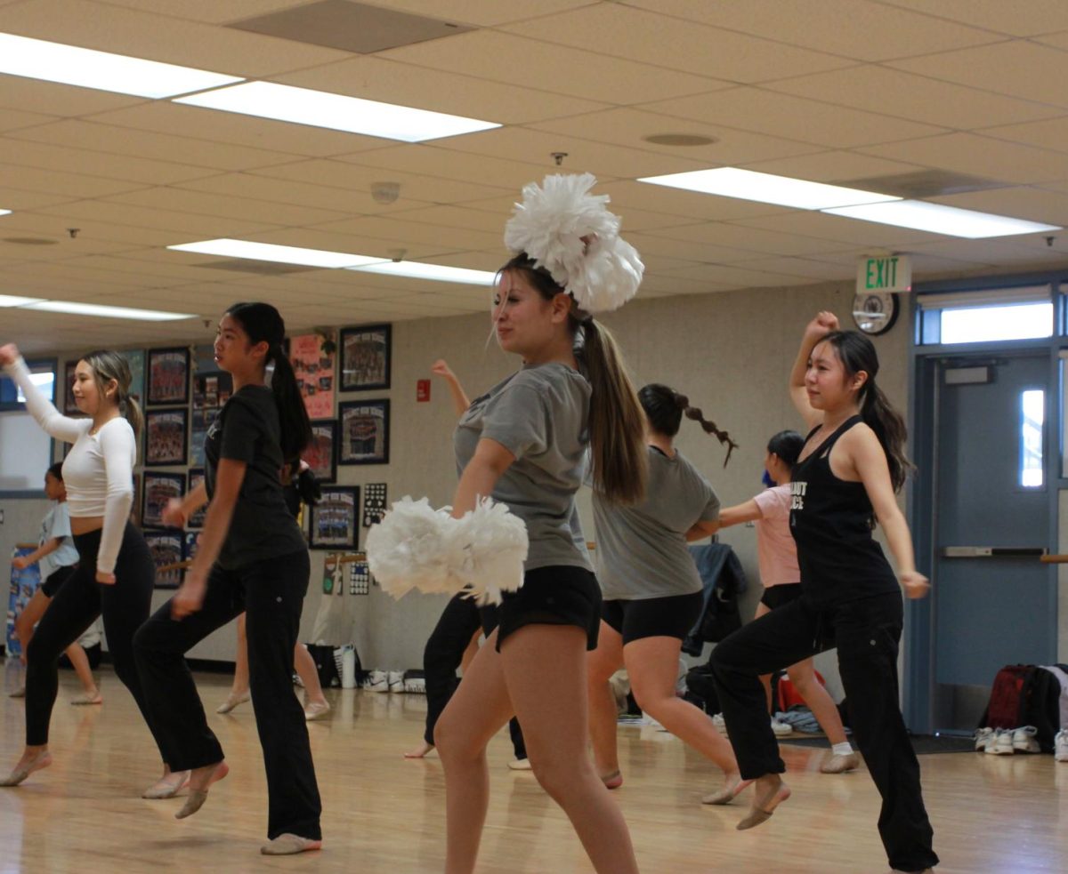 Sophomore Dance Team member Jocelyn Reyes dances along to the pom class choreography.