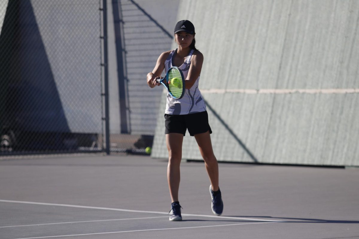 Freshman Megan Bui hits a backhand shot in a 11-7 Walnut victory over Glendora.