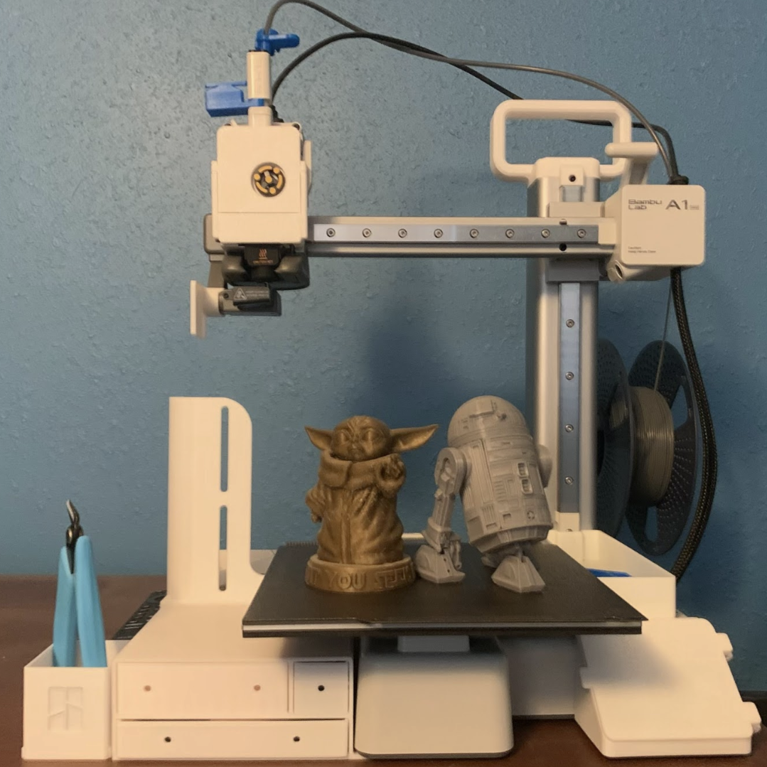 Shown above is sophomore Asher Bertulfo's 3-D printer and several items he's printed in the past. 