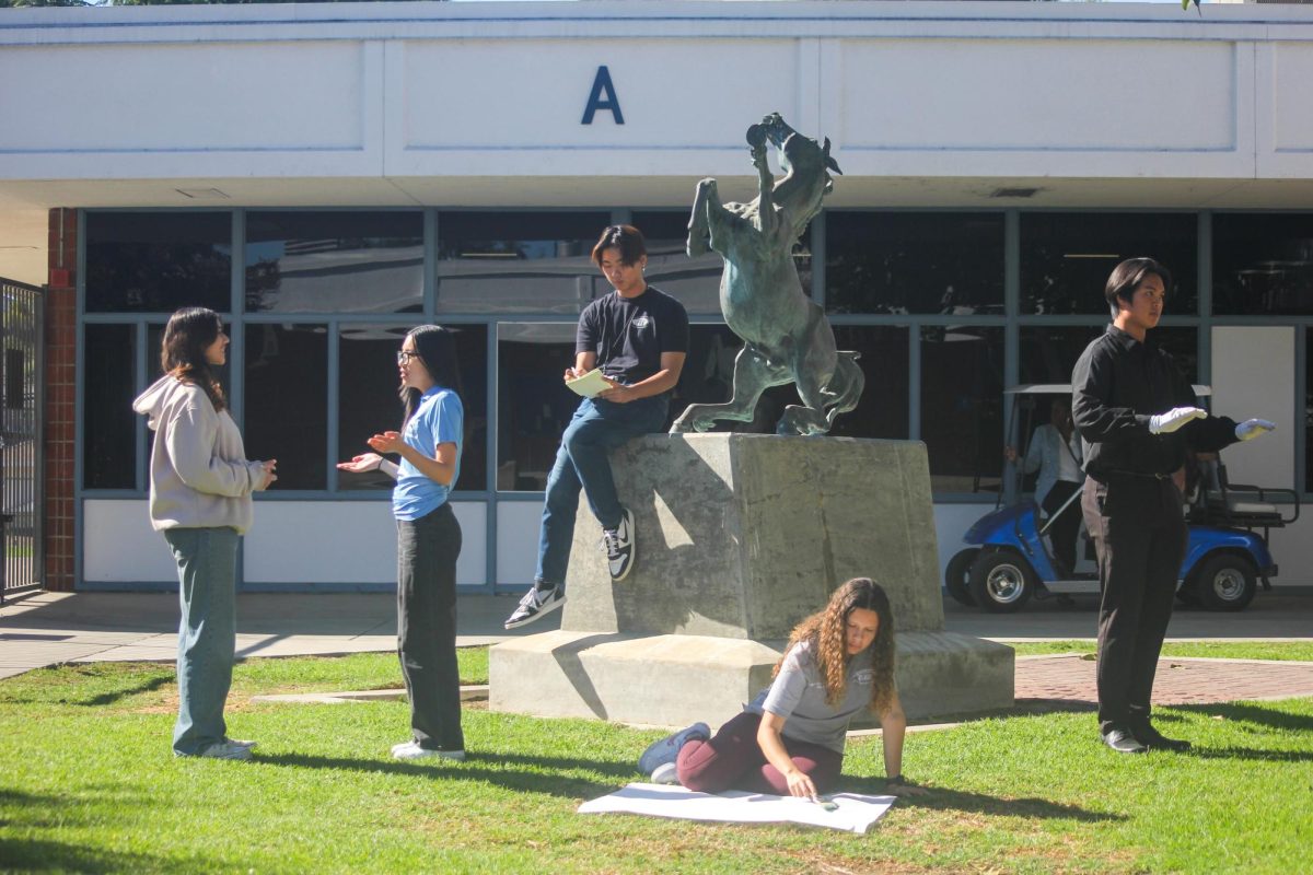 Representatives from various organizations demonstrate their respective roles. (From left to right) Seniors Jhanvi Doshi (Student Think Tank),  Aubrey Kwok (Peer Counseling), David Kang (Publications), Pitzil Avila Castellanos (ASB) and Jaden Diep (band).