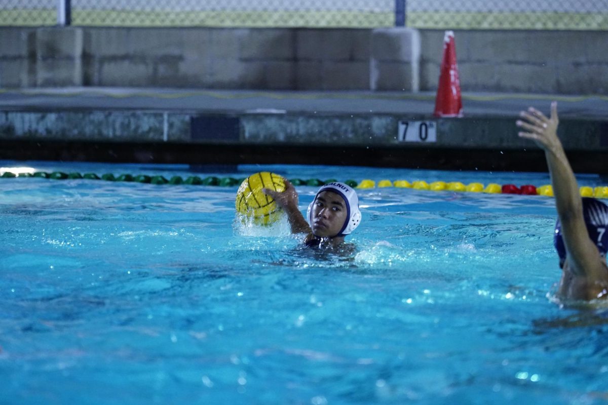 Making waves | Freshman Caleb Cobb throws the ball toward the goal in a opening round loss to Los Osos 11-12, Oct. 29. 