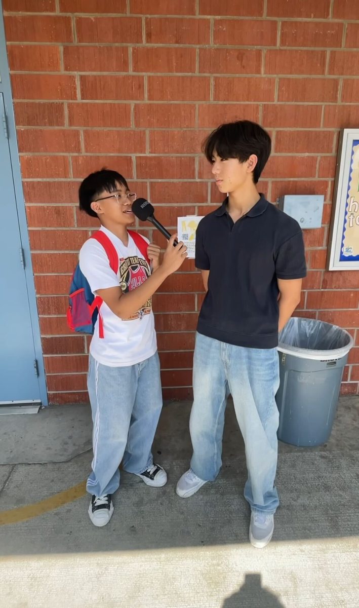 Senior Eden Joven "EJ" Madriaga (left) interviews senior Eric Wang (right). 