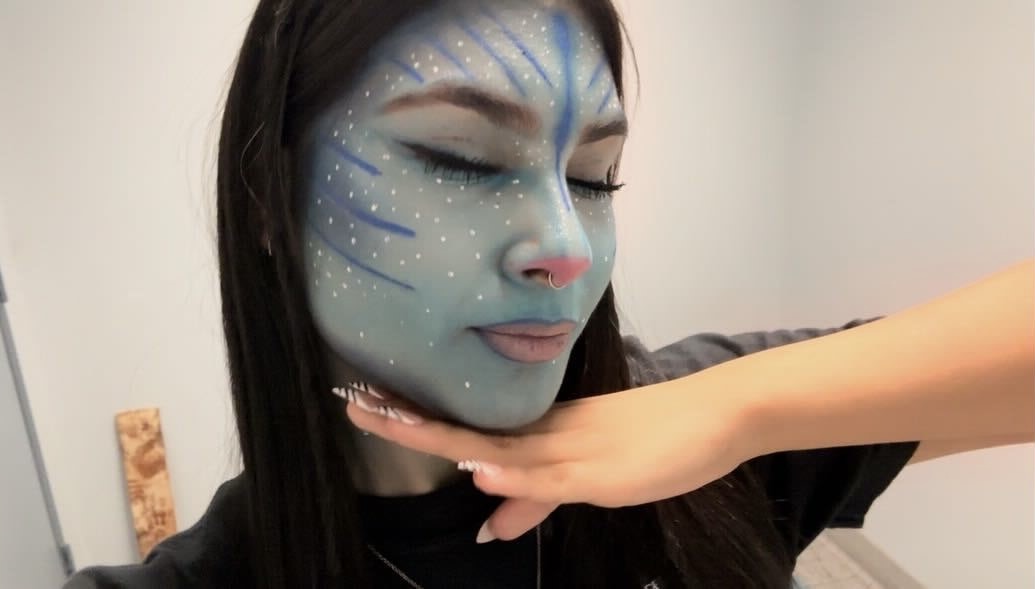 Junior Andrea Romo shows off her Avatar-inspired makeup look on Oct. 22. "[This look] was my favorite because I did it first try without even practicing and got it spot on," Romo said. 