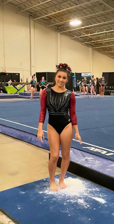 Sophomore Eva Sanchez prepares to warm up for her last floor routine in January 2025 at San Diego. “There are definitely going to be some aspects of competing that I will miss, but now that I’m focusing on school, I feel reminiscent of gymnastics,” Sanchez said. 