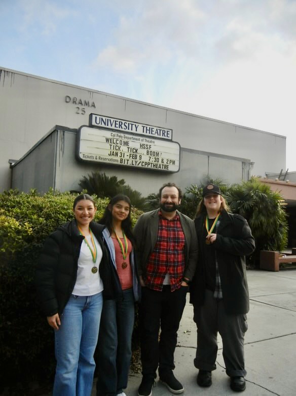 Savannah Castaneda, Gabriella Hernandez and Blaise Contryman (left to right) pose with Advanced Drama director Danny Campbell.