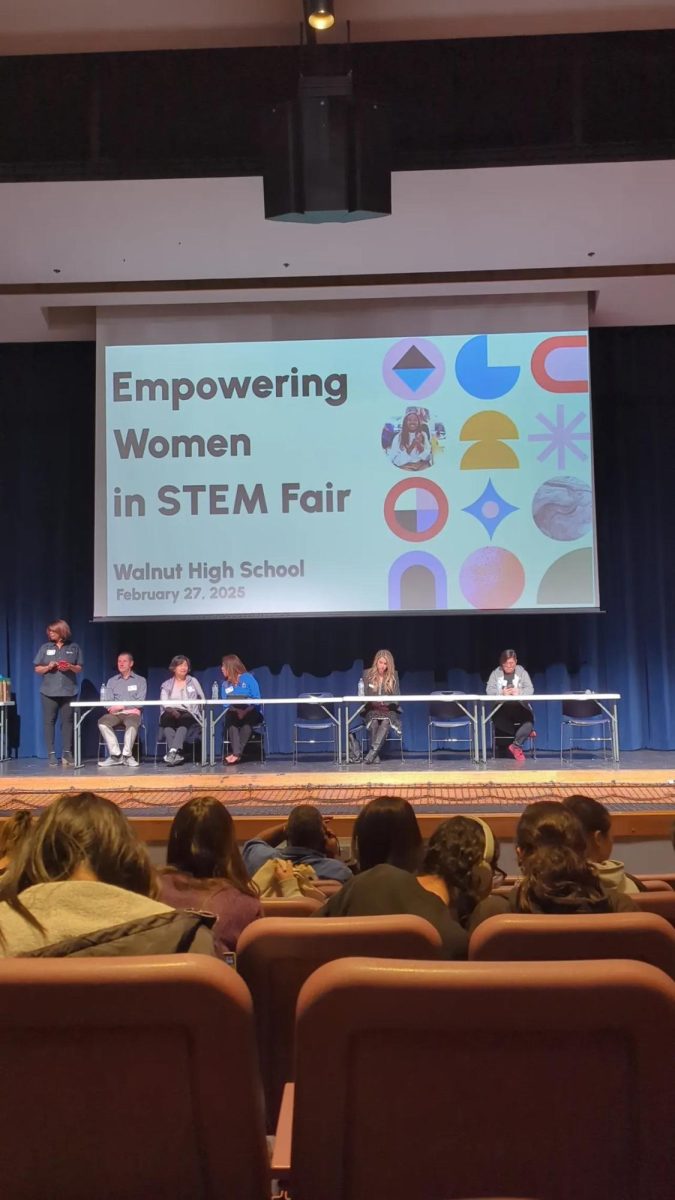 A panel of female leaders in the STEM field get ready to present to students about the journey they took to reach their career.