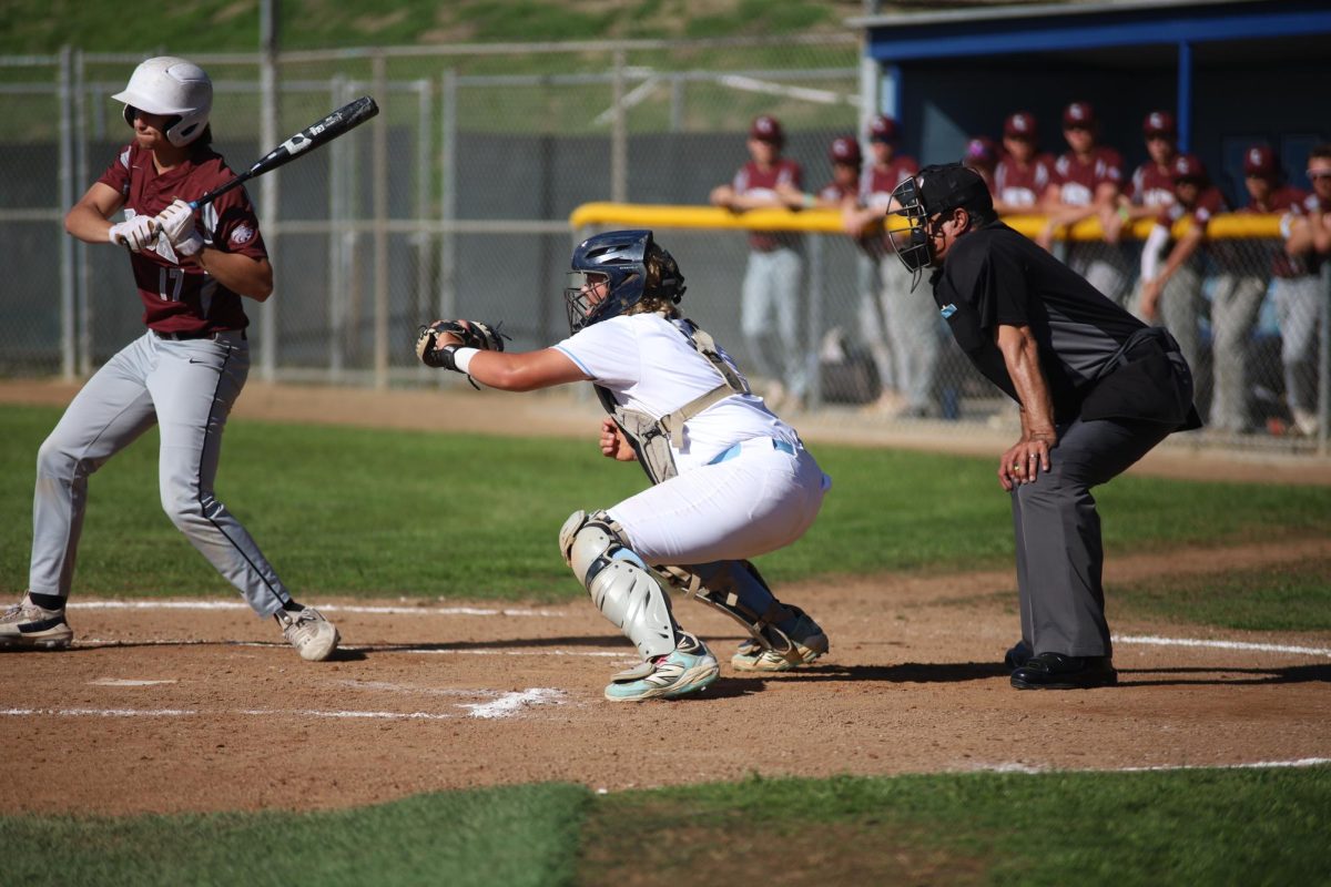 Senior Jackson Russo catches a ball in the game against Claremont. "I think defensively, I was good, but I could do better with hitting," Russo said.