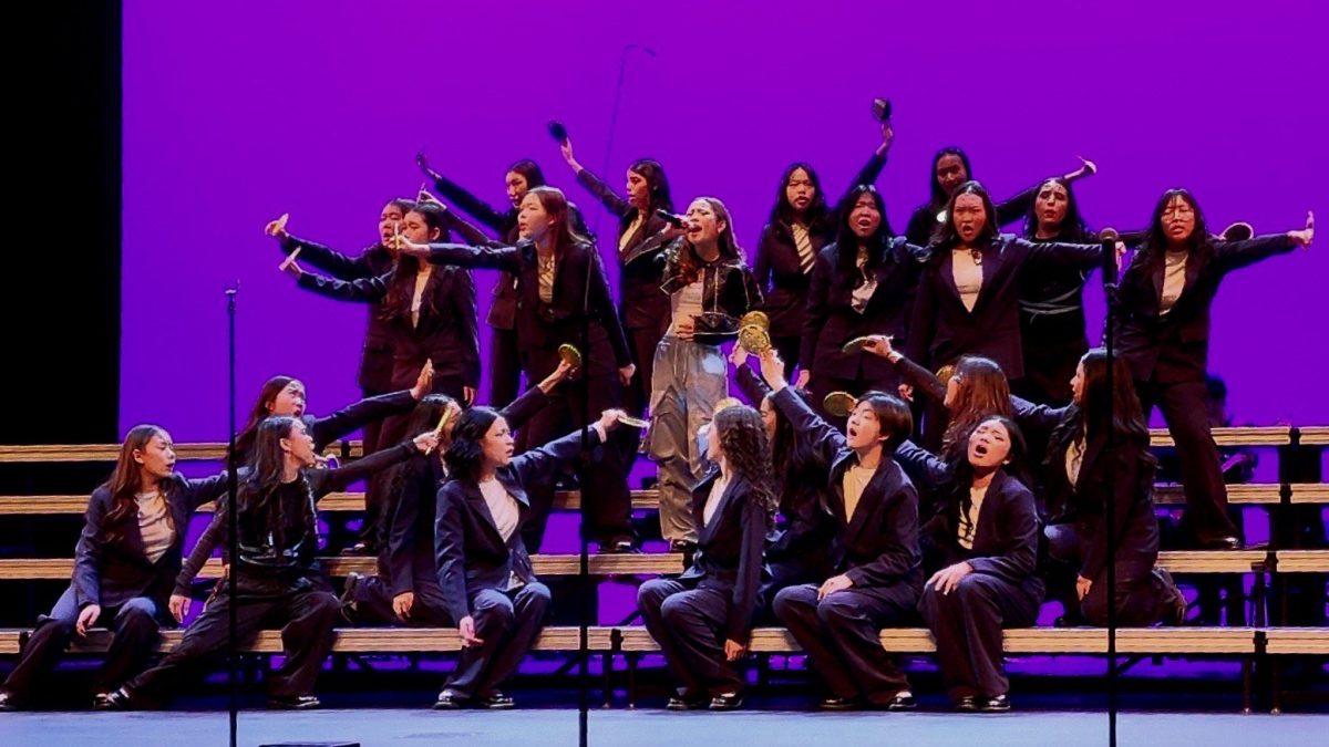 Kathryn Montoya (center) sings as the rest of Rhapsody in Blue goes into formation around her.