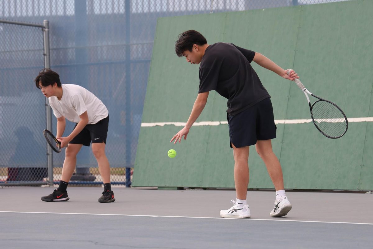 Senior Daniel Lee practices tennis after school.