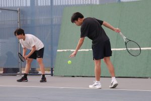 Senior Daniel Lee practices tennis after school.