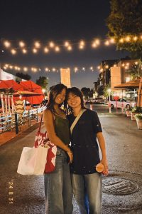 Roniya Salinas (left) and Makayla Wang (right) go on a date together at a flea market in Downtown Fullerton.