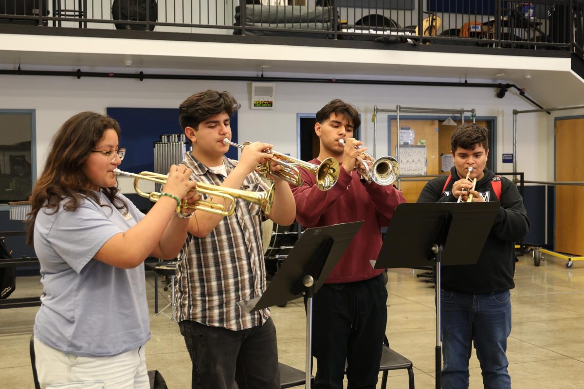 Jazz session | Jazz Band members, from left to right, trumpets sophomore Melanie Lopez, junior Gael Ruiz, senior Matthew Paz and rehearse their concert pieces.  