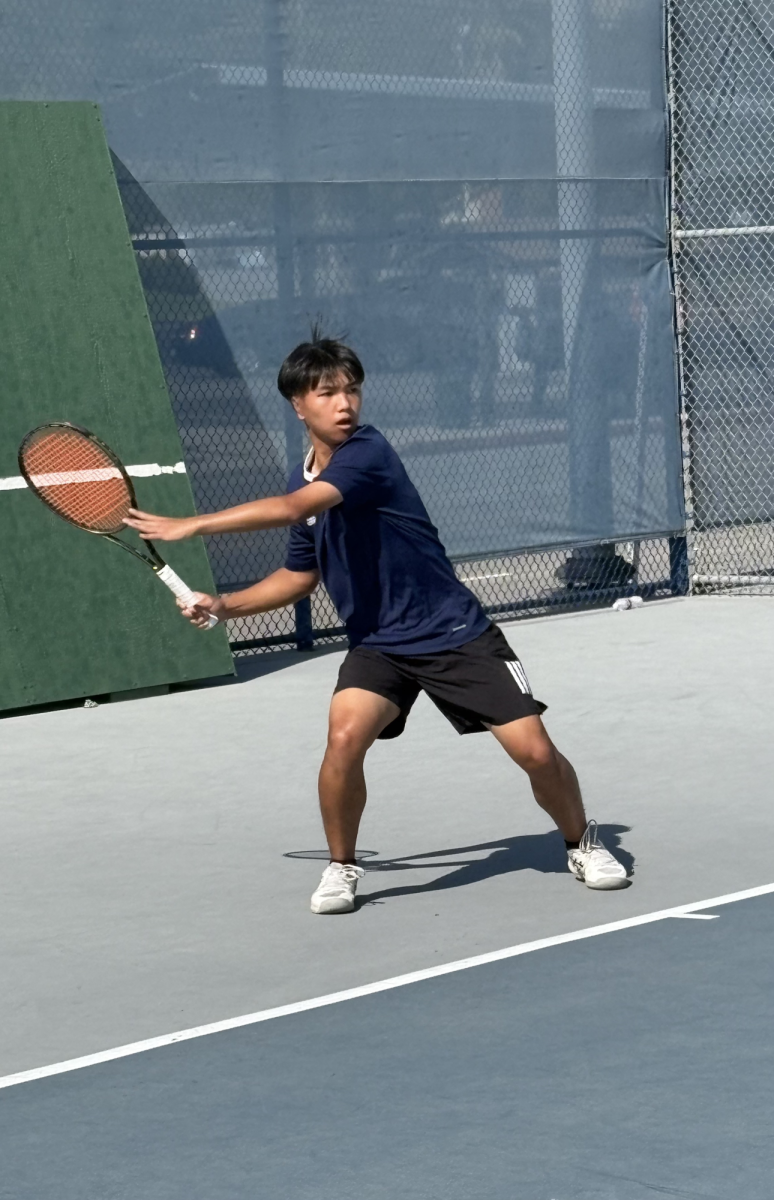 Sophomore Tony Yuan rallies with a forehand during his match.
