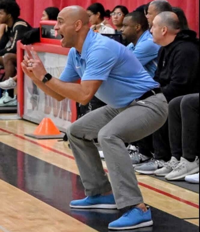 Urging defense | Coach Joe Khouzam stands beside his coaching staff on the sideline in a tournament against Glendora around five years ago.  “I was encouraging the team to just get one defensive stop.” 