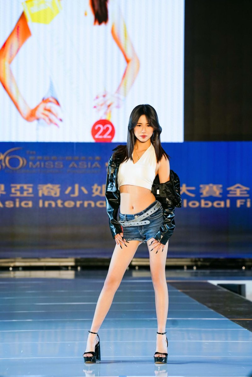 Sophomore Janice Lin poses on stage for the 2025 Miss Asia International Pageant.