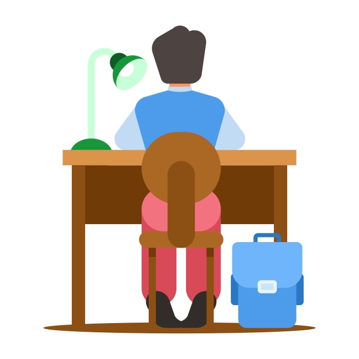 A focused student works on homework at their desk.