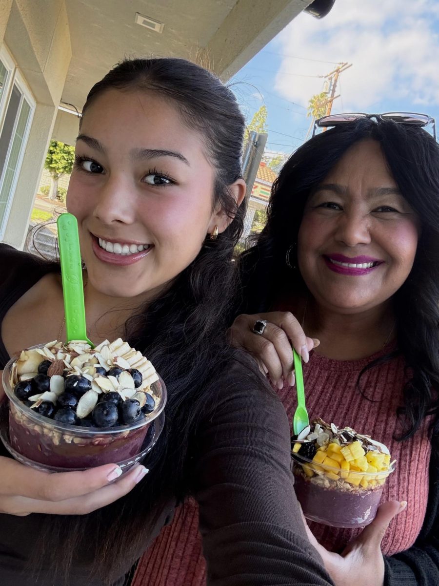 Acai Tuesdays | Junior Ellie Lopez and registrar Elizabeth Lopez enjoy their acai bowls together from Juugos. “I always get the acai base with berries, granola and chocolate chips, and my mom usually gets the acai base with blueberries, granola and shredded coconut,” Ellie said.