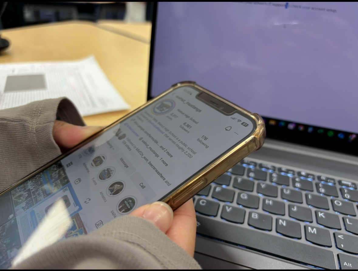 A student scrolls through Instagram during class.