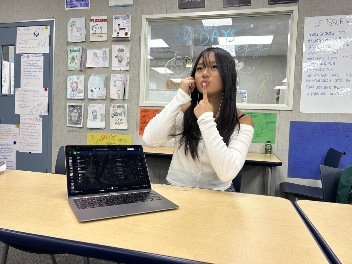 Copy editor-in-chief senior Jocelyn Chen contemplates the user interfaces on music streaming platform Spotify while listening to music artist SZA.