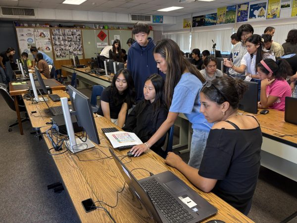 Navigation to Story: Students in Advanced Graphic Design mentor middle schoolers