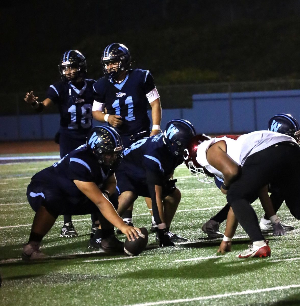 Communication is key | Senior Noah Solis talks to his teammates and his coach on a play. (Photo by Lucas Lim)