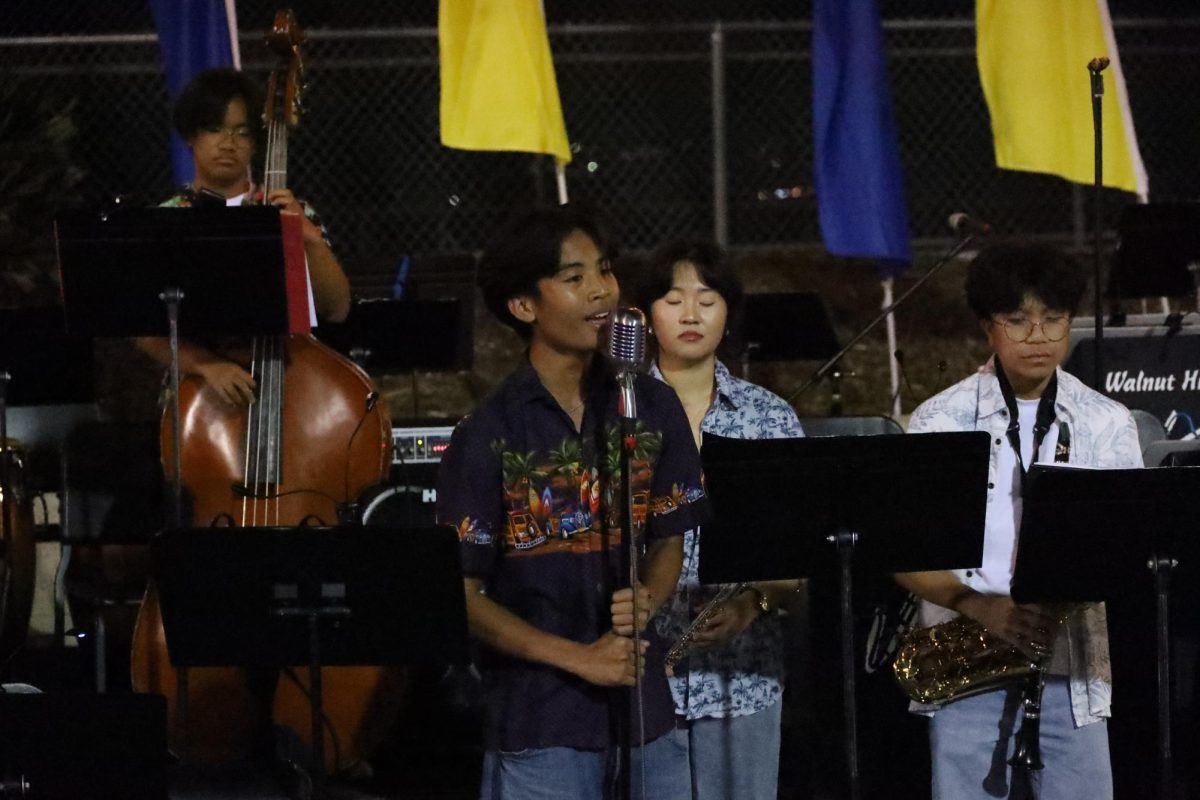 Baritone senior Isaiah Uman performs his small ensemble song, “La Vie En Rose” during Jazz at Sunset. “I really hope the audience enjoyed my performance as well as the Jazz Bands’.  Even though I may have some nerves I am still confident in my voice,” Uman said.