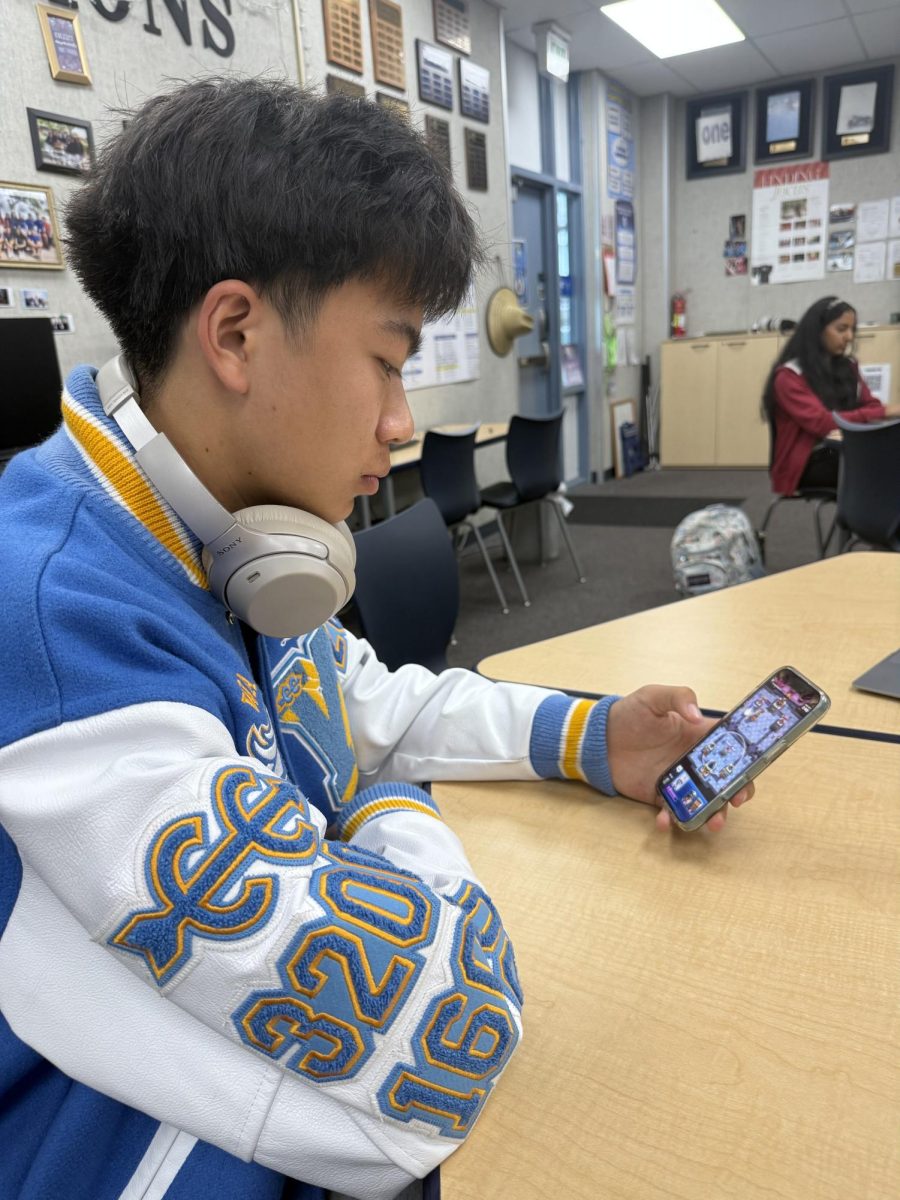 Junior Lucas Lim plays Clash Royale during lunch, picking the game back up after previously playing Supercell's other hit video game, Brawl Stars.