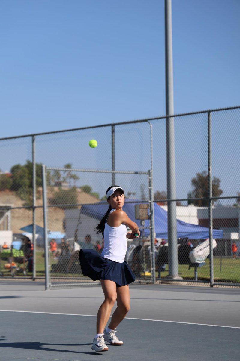 Singles one sophomore Brigitte Hsieh hits a backhand during a rally.