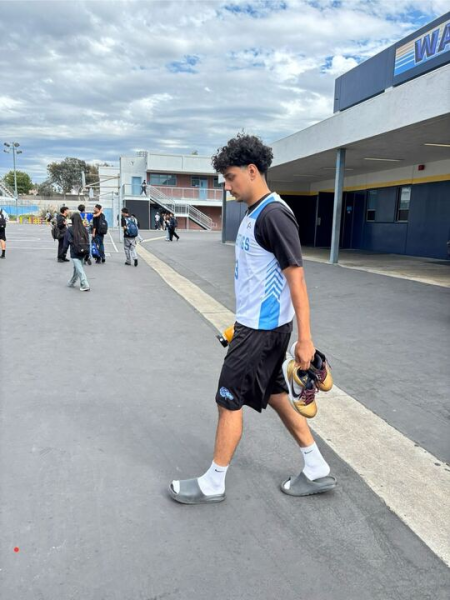 Senior Zayn Karim heads to the new gym for sixth period basketball practice. Karim looks forward to the upcoming season and believes that team chemistry has not been affected despite  significant roster and staffing changes.