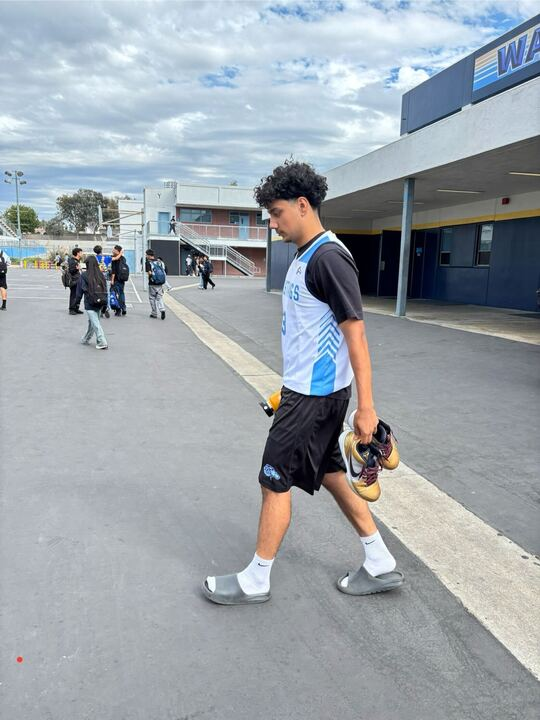Senior Zayn Karim heads to the new gym for sixth period basketball practice. Karim looks forward to the upcoming season and believes that team chemistry has not been affected despite  significant roster and staffing changes.