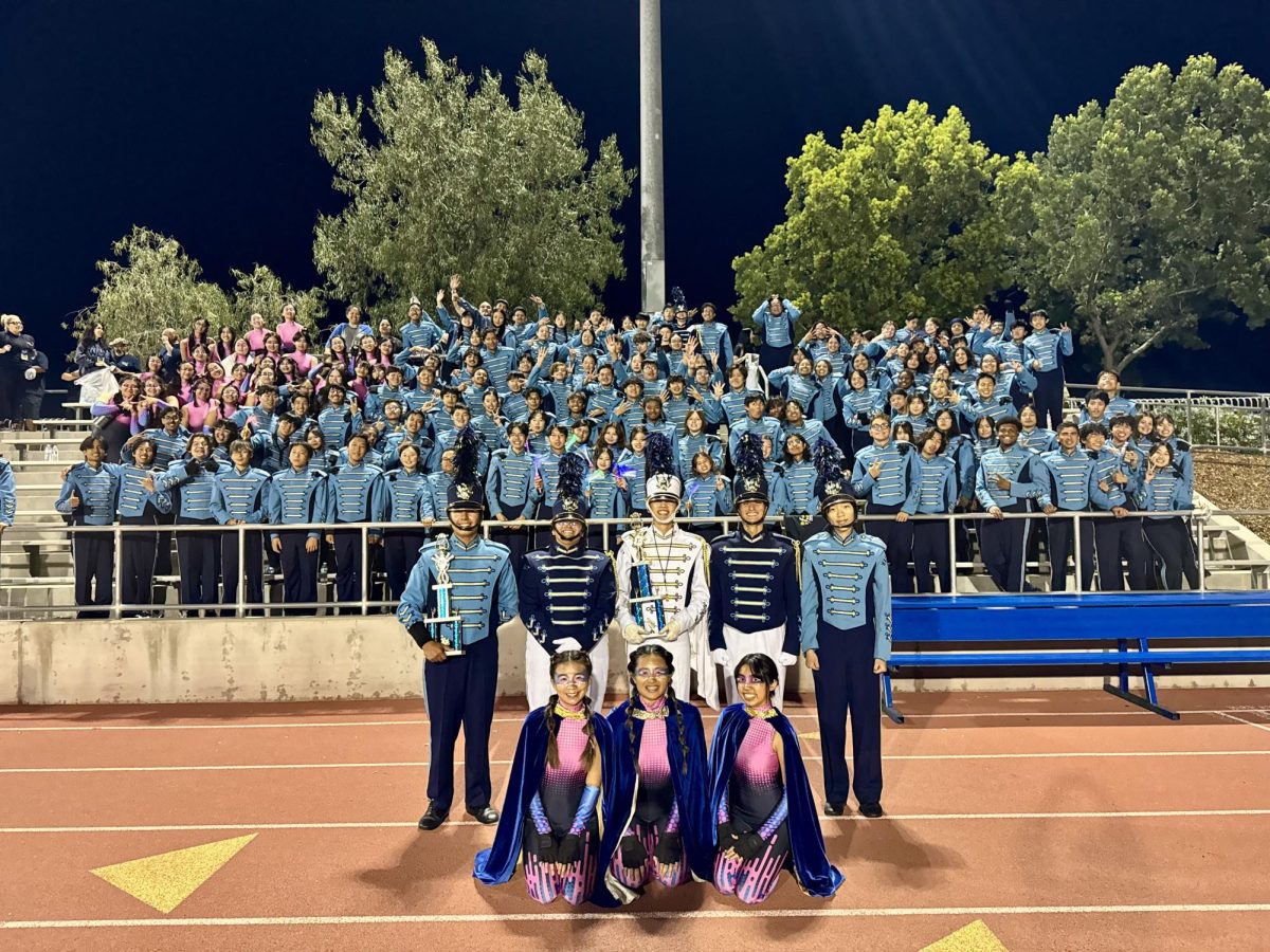 Marching Band and Color Guard gathers around for a group picture after the competition. (Photo courtesy of Katie Takahashi)