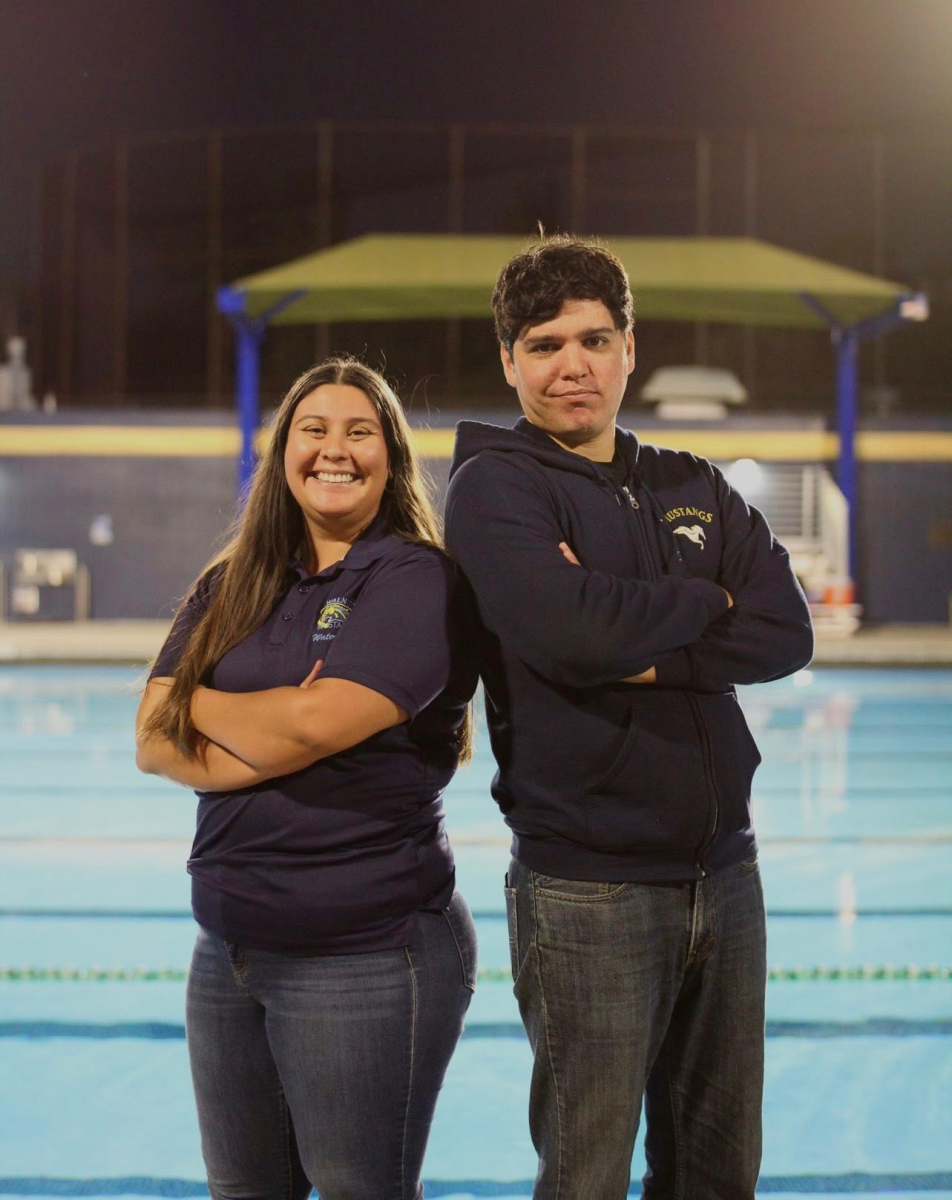 Girls water polo head coach Ashley Garcia (left) and boys head coach Bryan Canchola (right) pose for a picture together. 