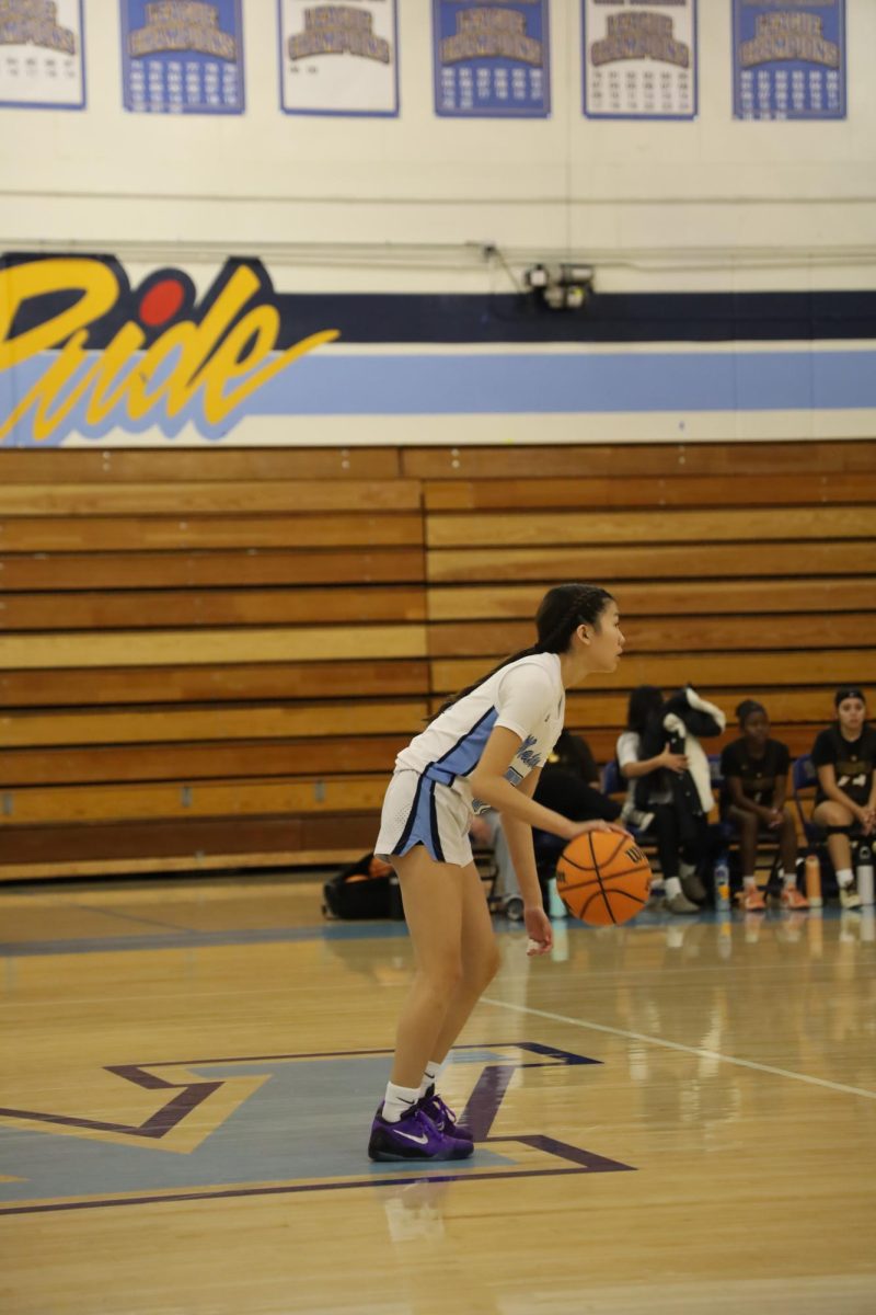 Waiting with patience | Point guard sophomore Jada Jao dribbles the ball while waiting for her teammates to set up for a play.  