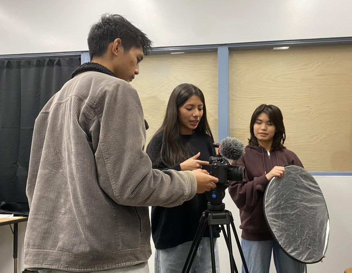 Capturing passion | From left to right, Advanced Digital Video Production students seniors Miguel Villavert,  Adriana Pelayo and sophomore Celyn Fuente discuss their production. “I was telling our camera person what angle I wanted so that we could create a tone I wanted,”  Pelayo said.