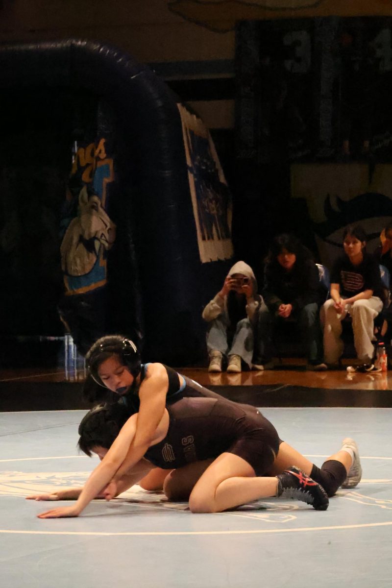 Strength matters | Sophomore Malia Quirante tries to transition to a half nelson on her opponent from Diamond Bar High School.  