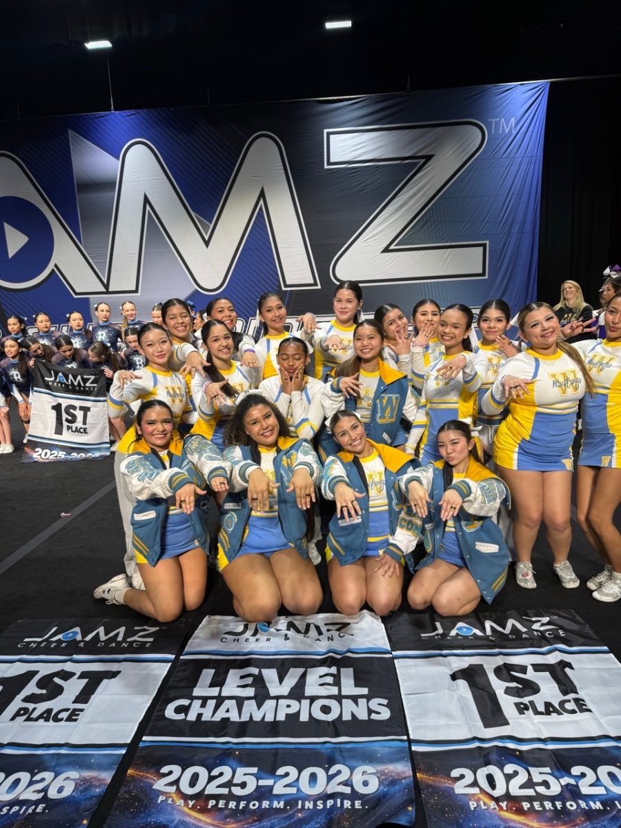 Varsity Cheer poses for a picture after winning first place at their competition. (Photo courtesy of Tisha Pesantes)