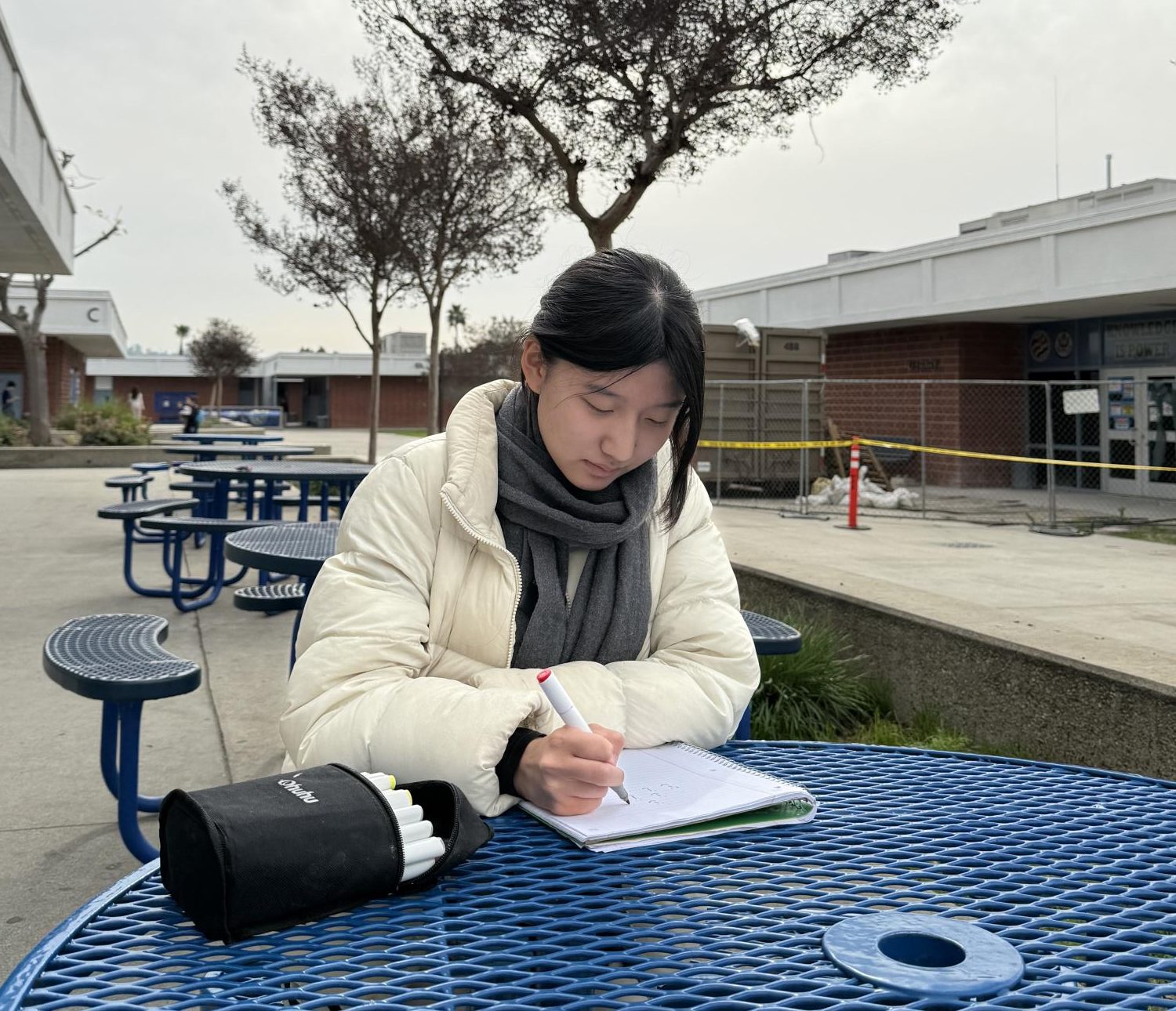 Painting with love | Advanced Art student junior Molly Chung draws in her notebook for class while expressing her creativity. “Friday is [usually] critique and Monday is figure drawing. It’s fun. When I get home, I set aside time specifically to draw,” Chung said. 