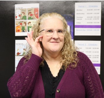 American Sign Language (ASL) teacher Sara Gray-Castro signs her Deaf name given to her by a fellow Deaf teacher she met in 2017 at a ASL Teachers Associations conference. Deaf names are unique to the Deaf community and often describe the appearance of the person, which can not be given by the person themselves, but by another member of the Deaf community.
“He came up with [my] name sign based on my natural red hair, blue eyes and freckles. And the four finger movement is indicated for my four letter name, Sara,” Gray-Castro said. 